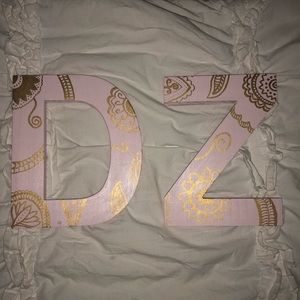 Gold embroidered blush pink Delta Zeta letters